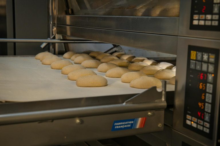 Artisan bread baking in an industrial oven at a bakery in Berlin, Germany. Fresh and delicious.